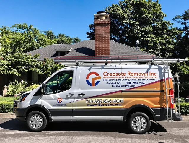 Bellingham Chimney Sweep technician removing creosote safely in Bellingham, MA